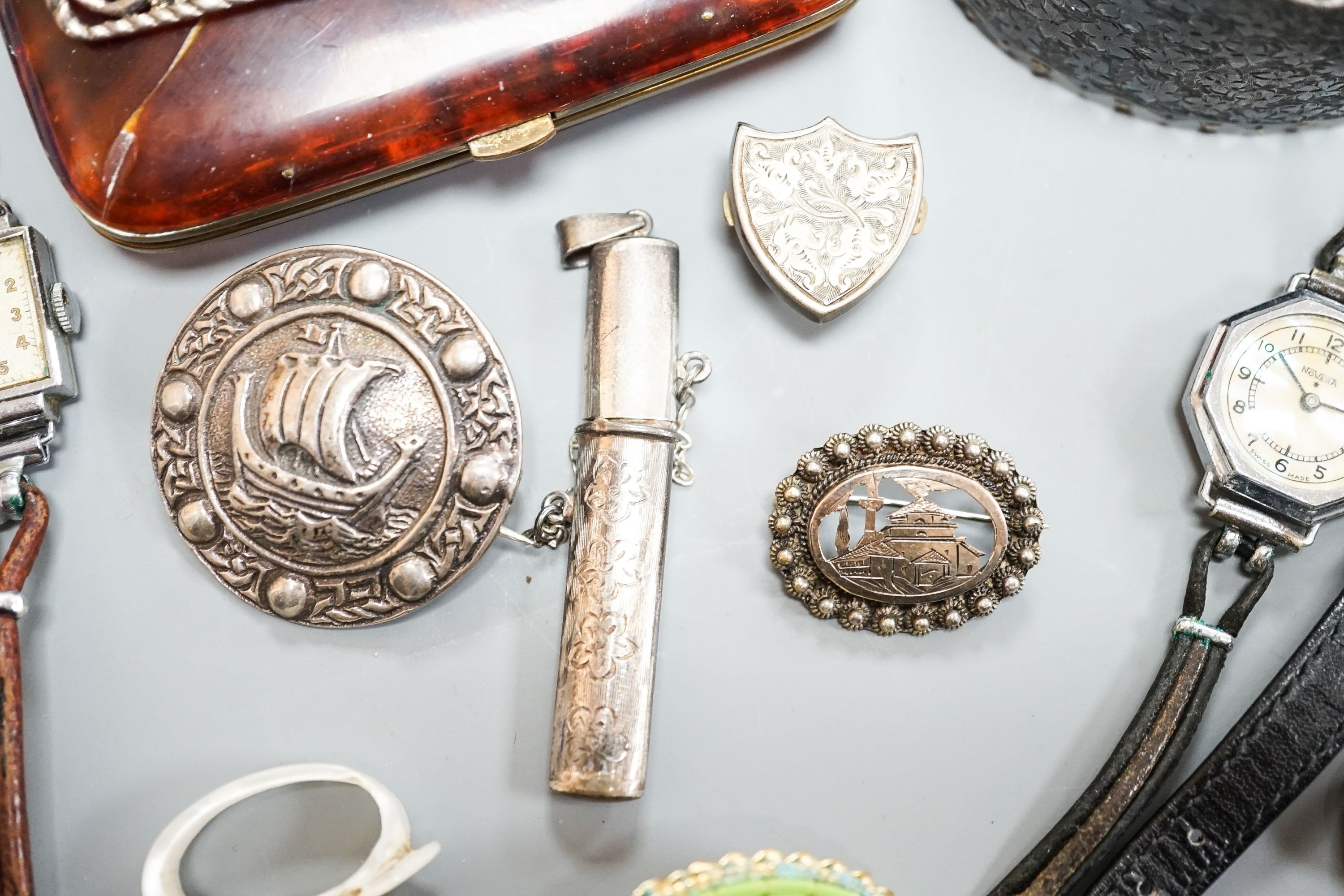 An engraved silver bangle, two silver brooches, including Scottish, two lady's wrist watches and a small group of minor jewellery, etc.